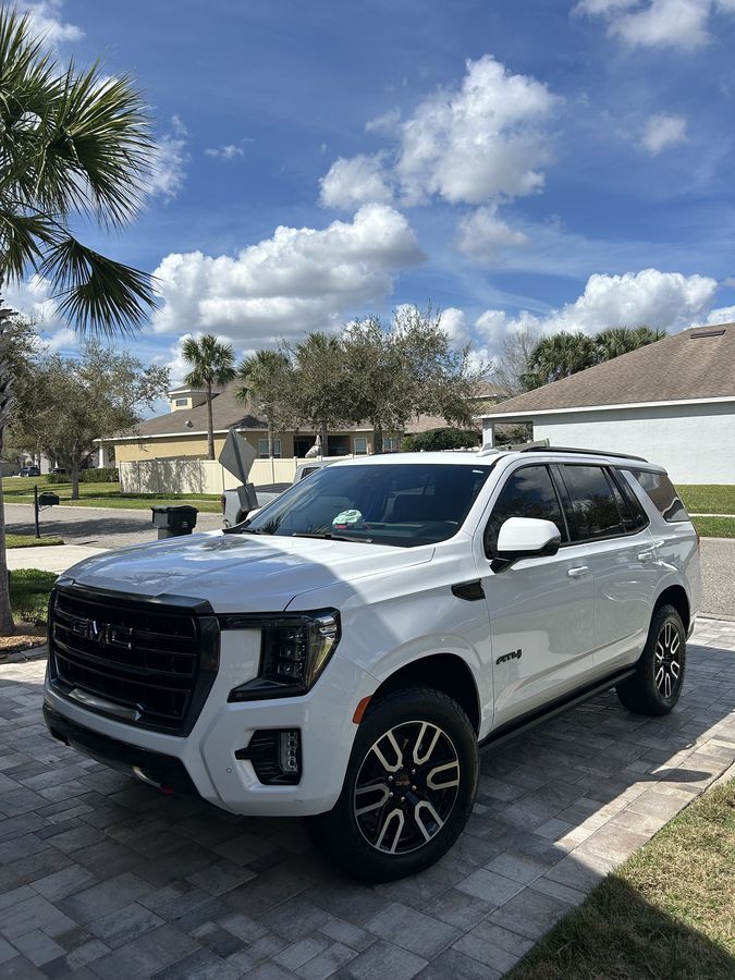 White GMC Yukon AT4 finished on a driveway