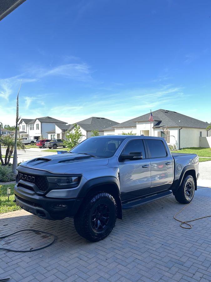 Silver Ram TRX on a driveway with the wash gear still out