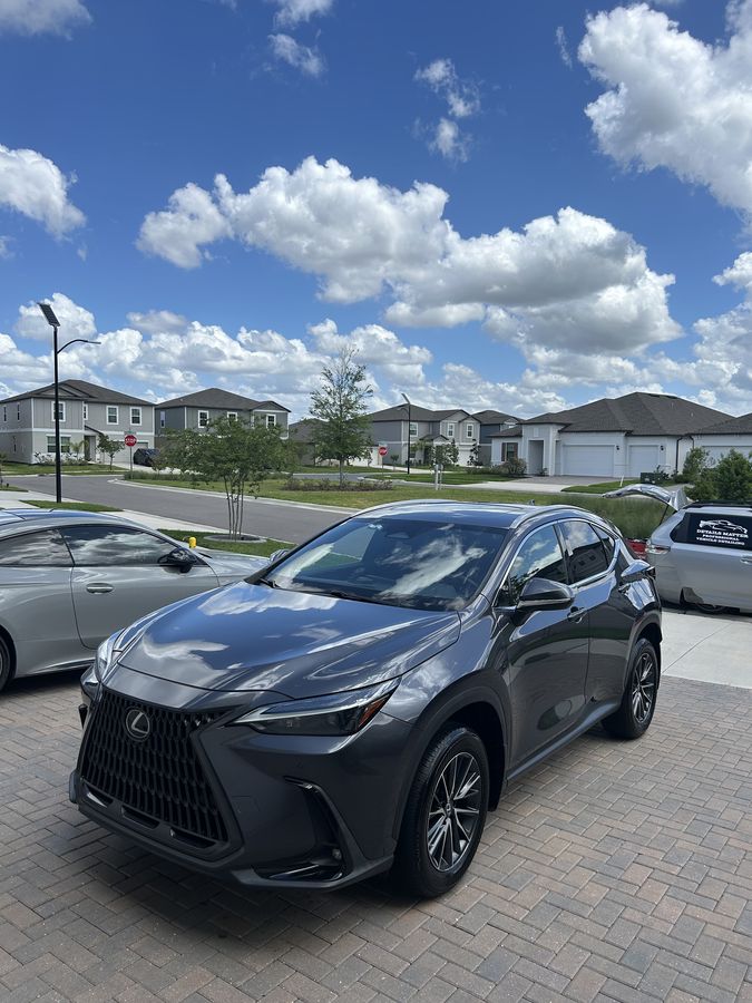 Grey Lexus NX on block paving, glass and trim clean
